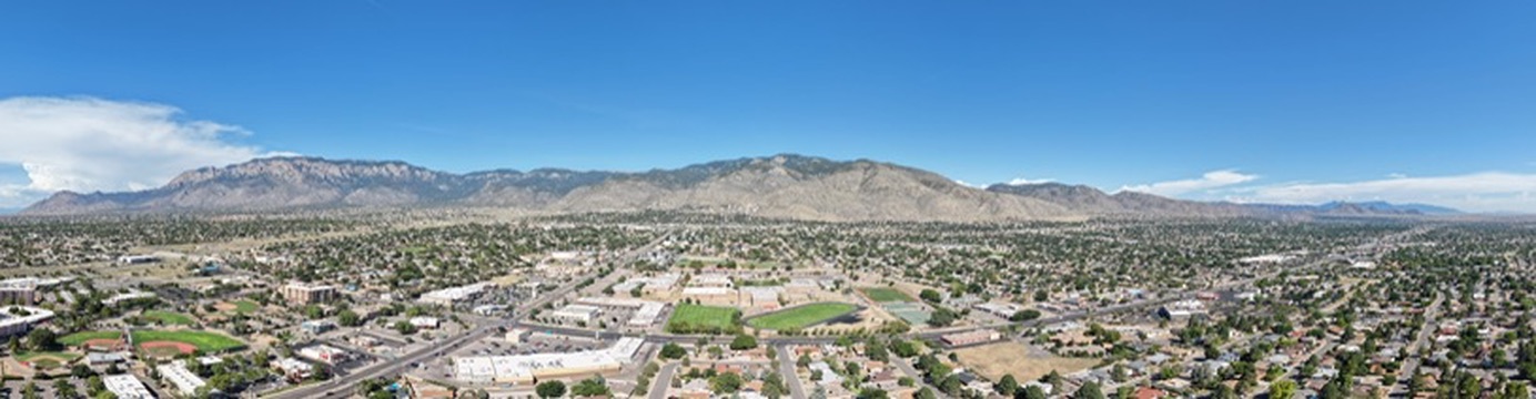 Aerial panorama over Albuquerque toward the Sandia Mountains